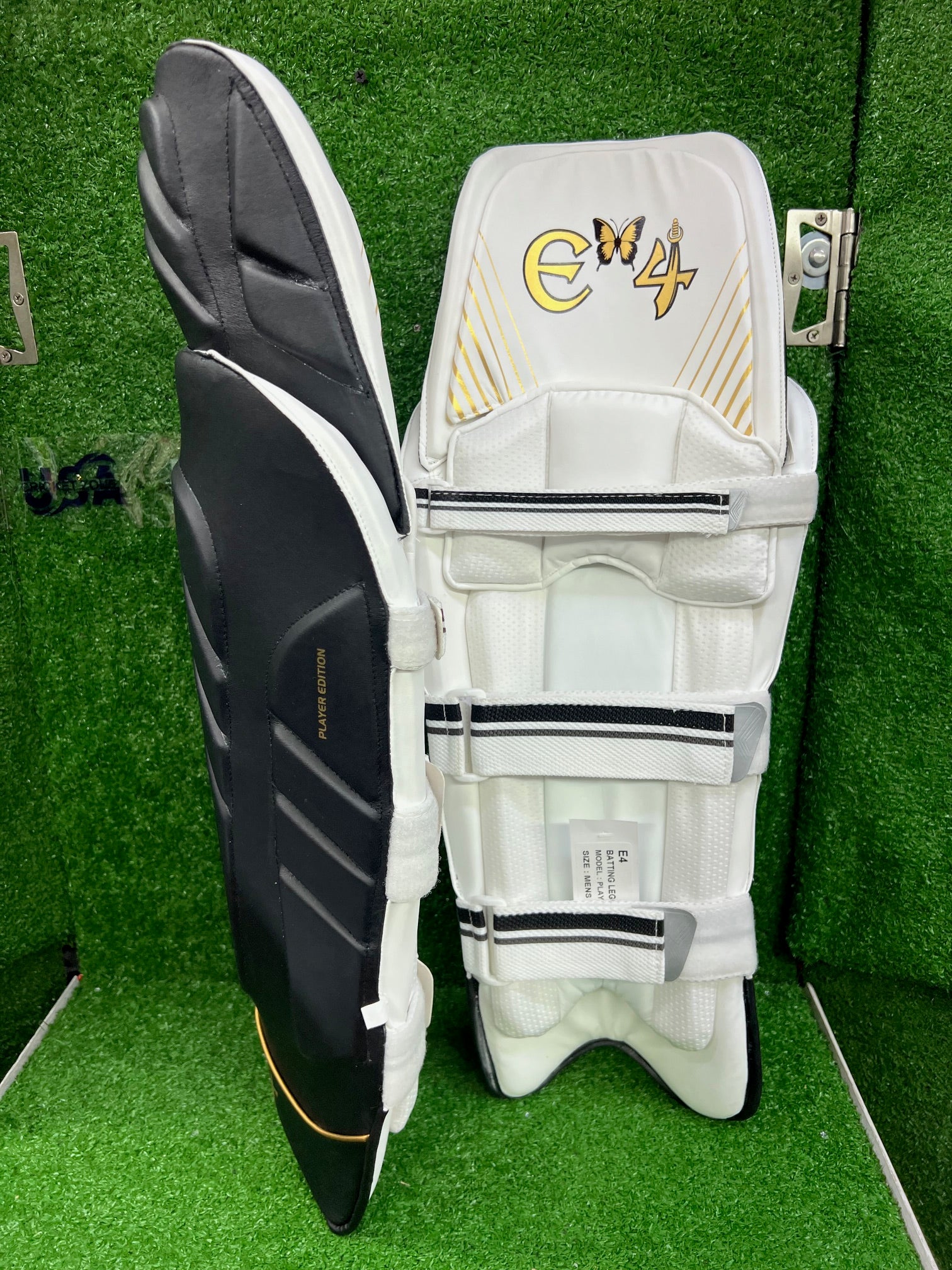 E4 Player's Edition Black and Gold Batting Leg Guard - 2024