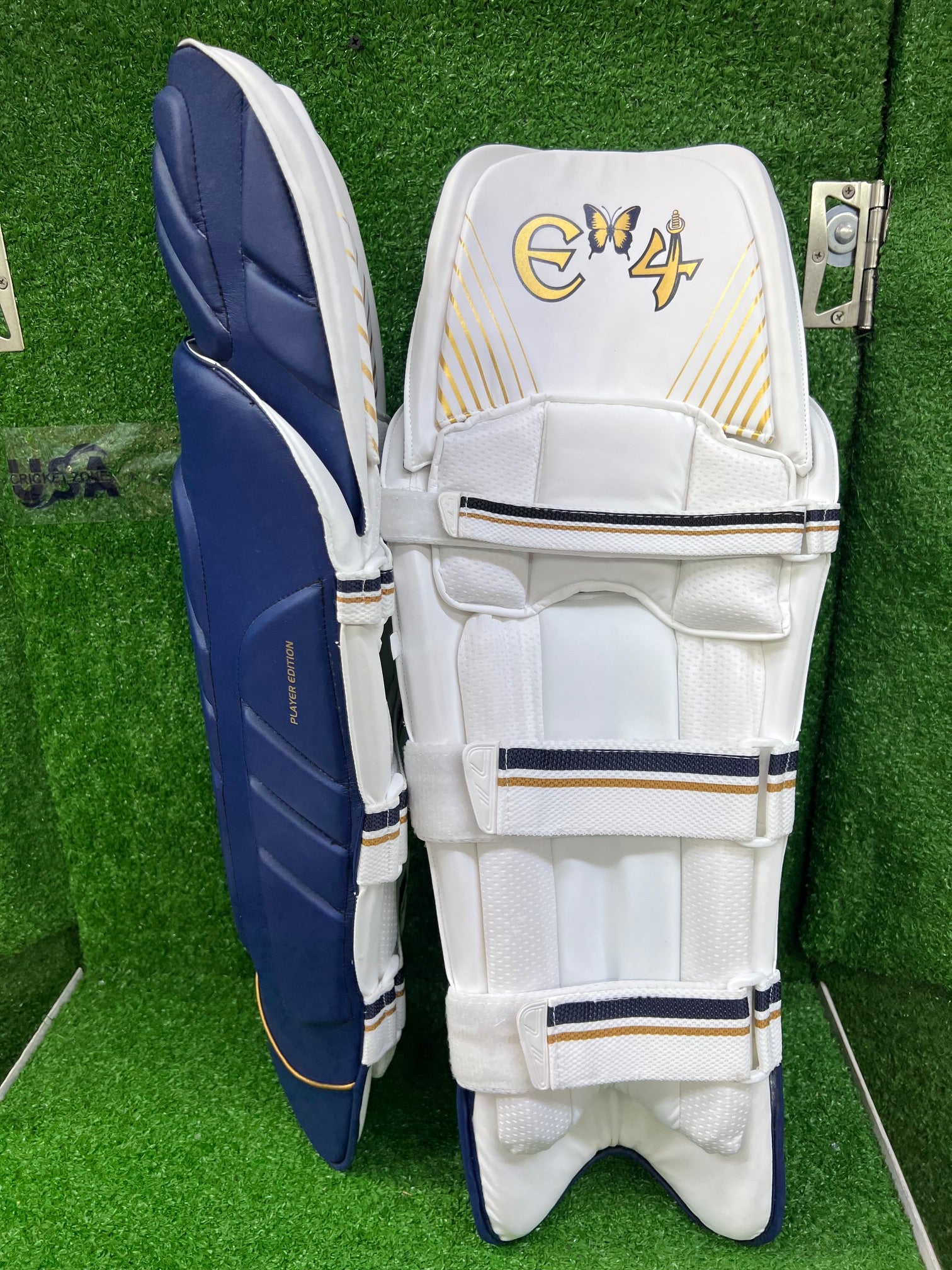 E4 Player's Edition Navy Blue and Gold Batting Leg Guard - 2024
