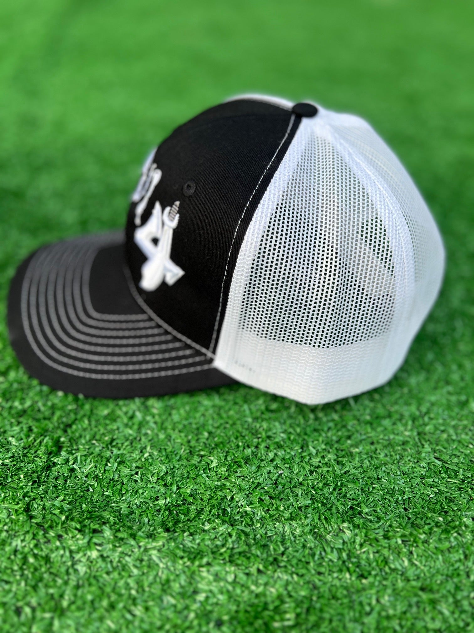 2025 E4 Trucker Hat - Black & White